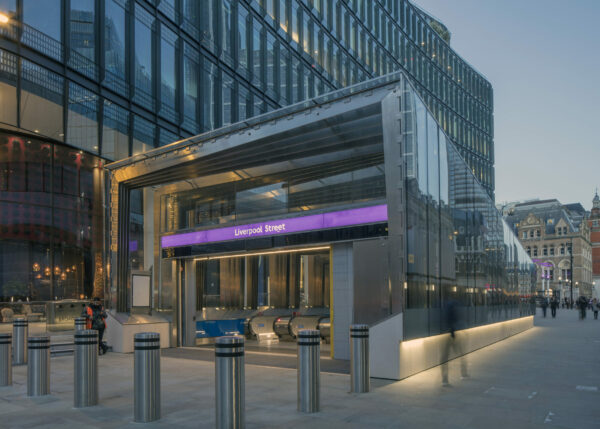 Exterior shot facing the Liverpool Street Station entrance at street level, at dusk